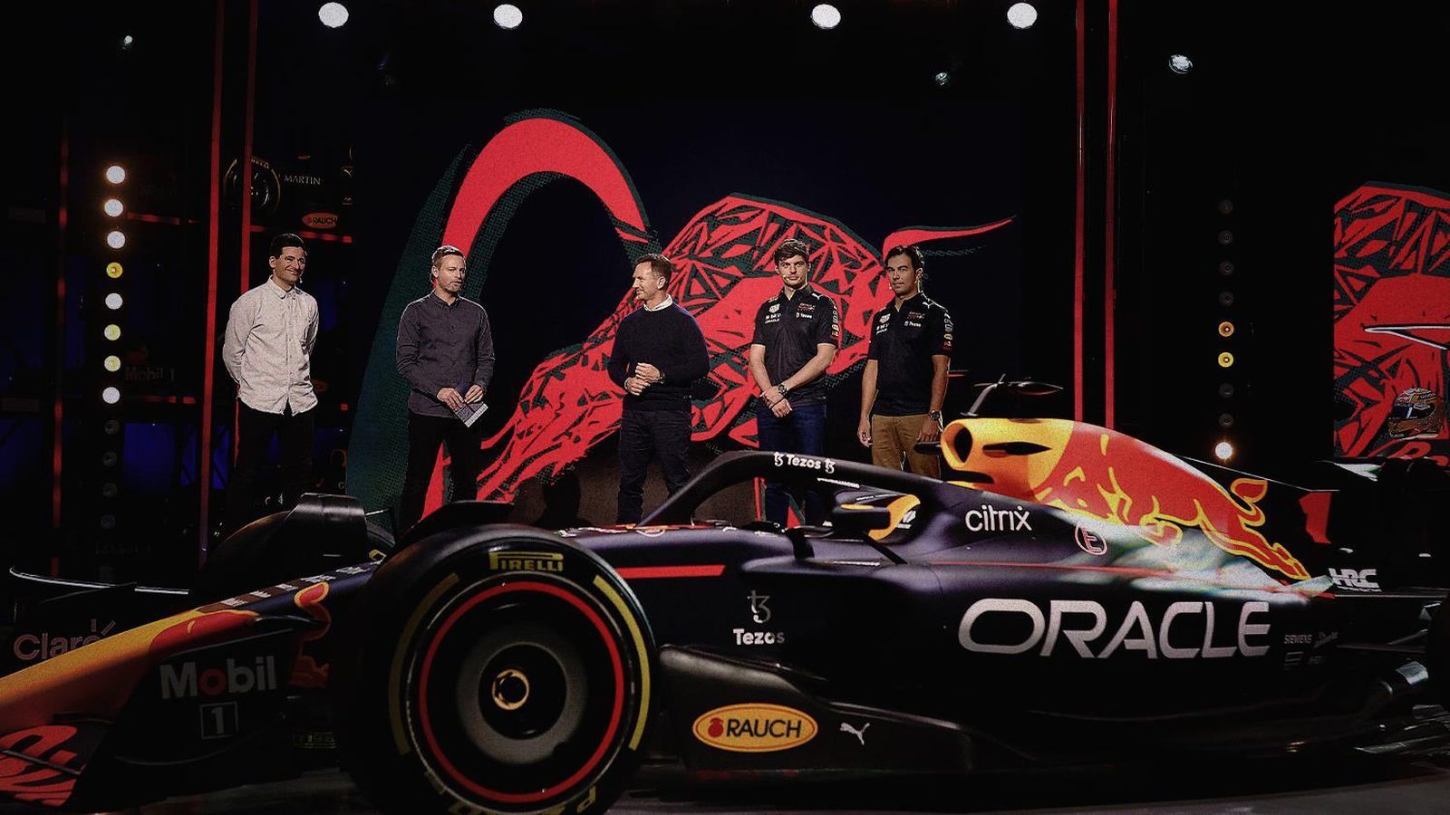 Oracle Red Bull Racing's 2022 Formula One car on the launch stage with the team alongside it.